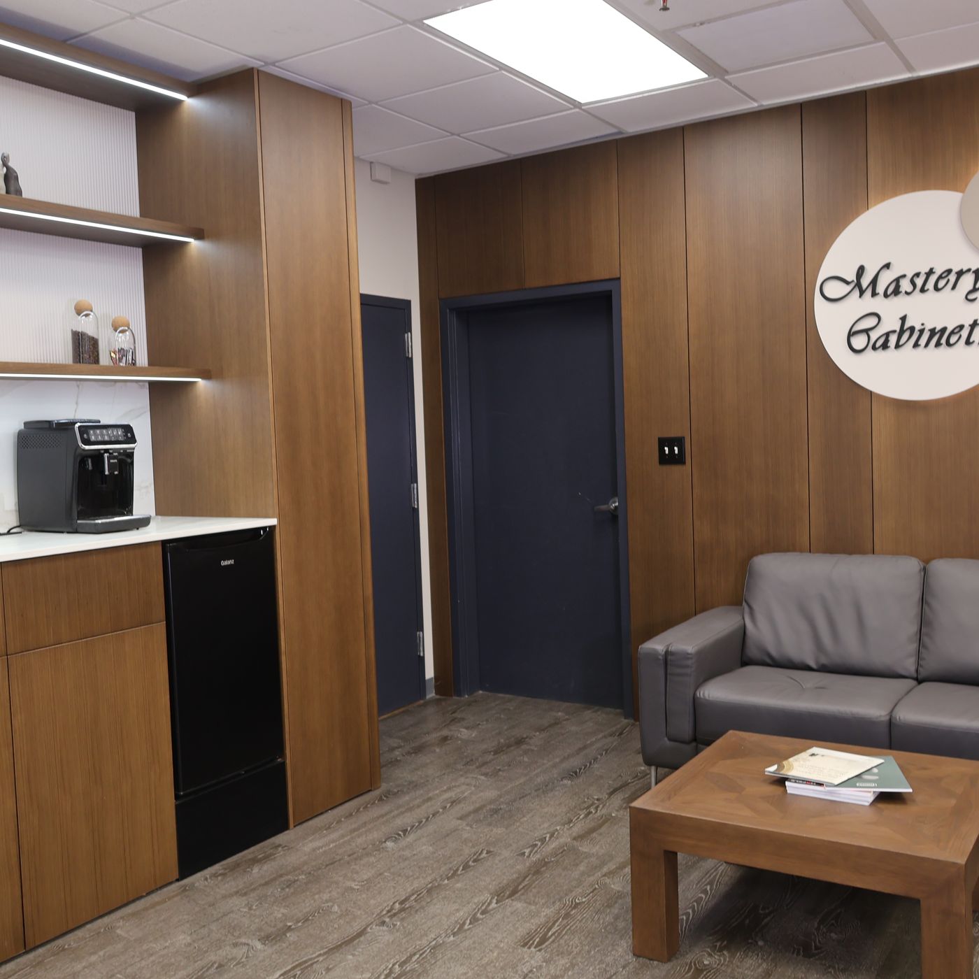 Custom walnut cabinetry and seating area at Mastery Cabinetry Orlando