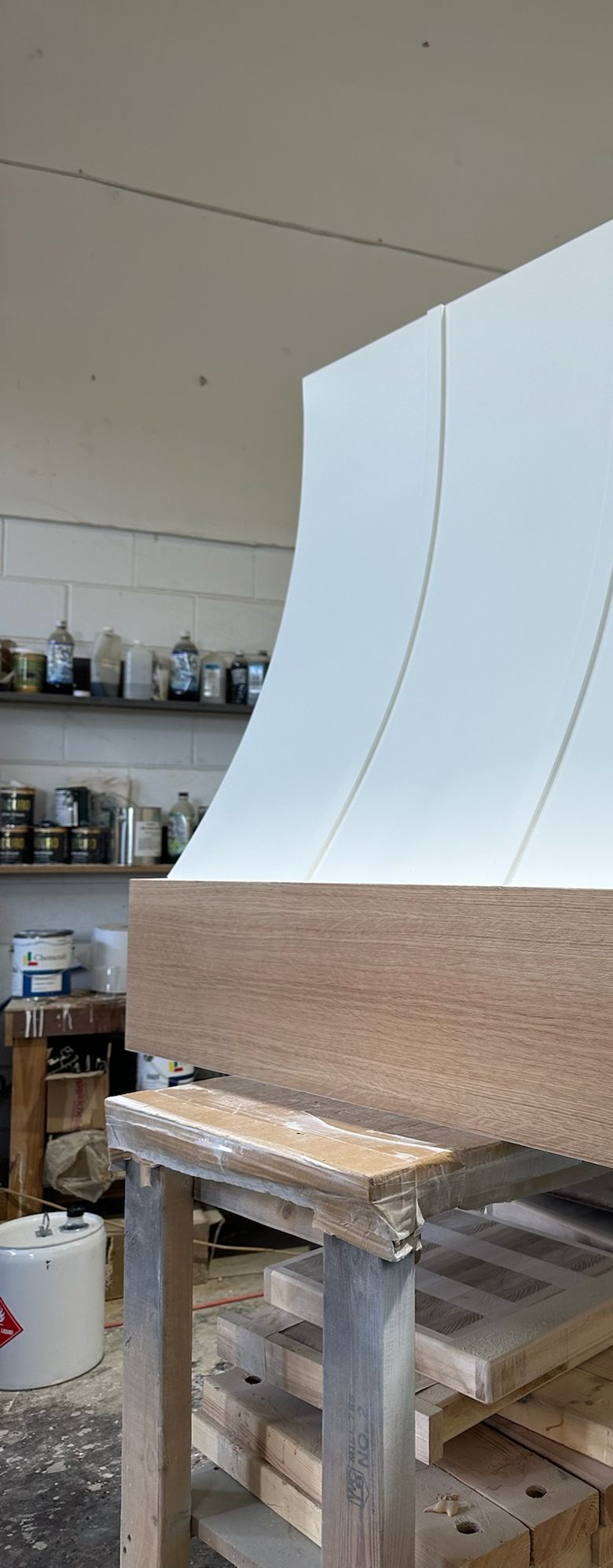 Cabinet maker building a custom range hood in the Orlando workshop