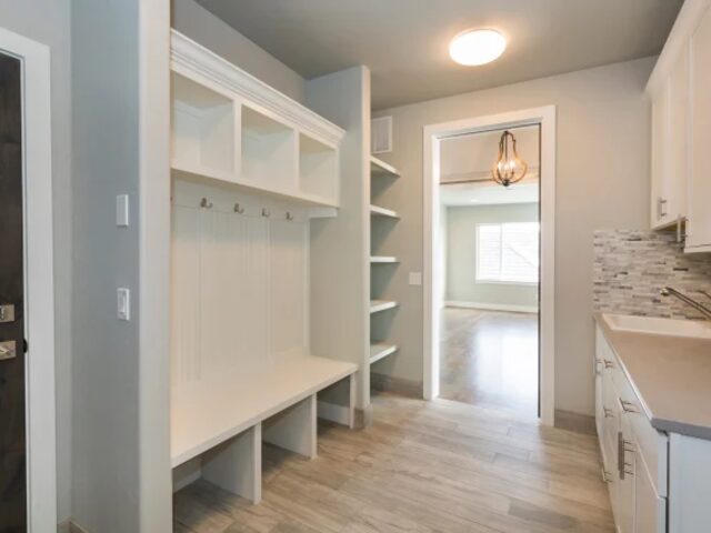 Custom mudroom and entryway storage by Mastery Cabinetry