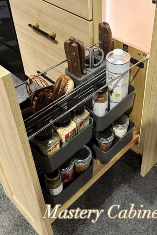 Pull out spice and pantry storage built by Mastery Cabinetry